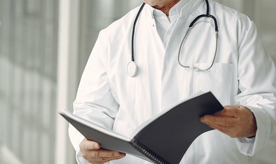 A doctor reading a file
